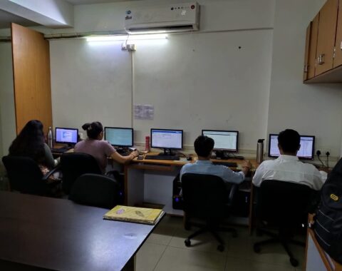 Students at a workshop for advanced computer training.